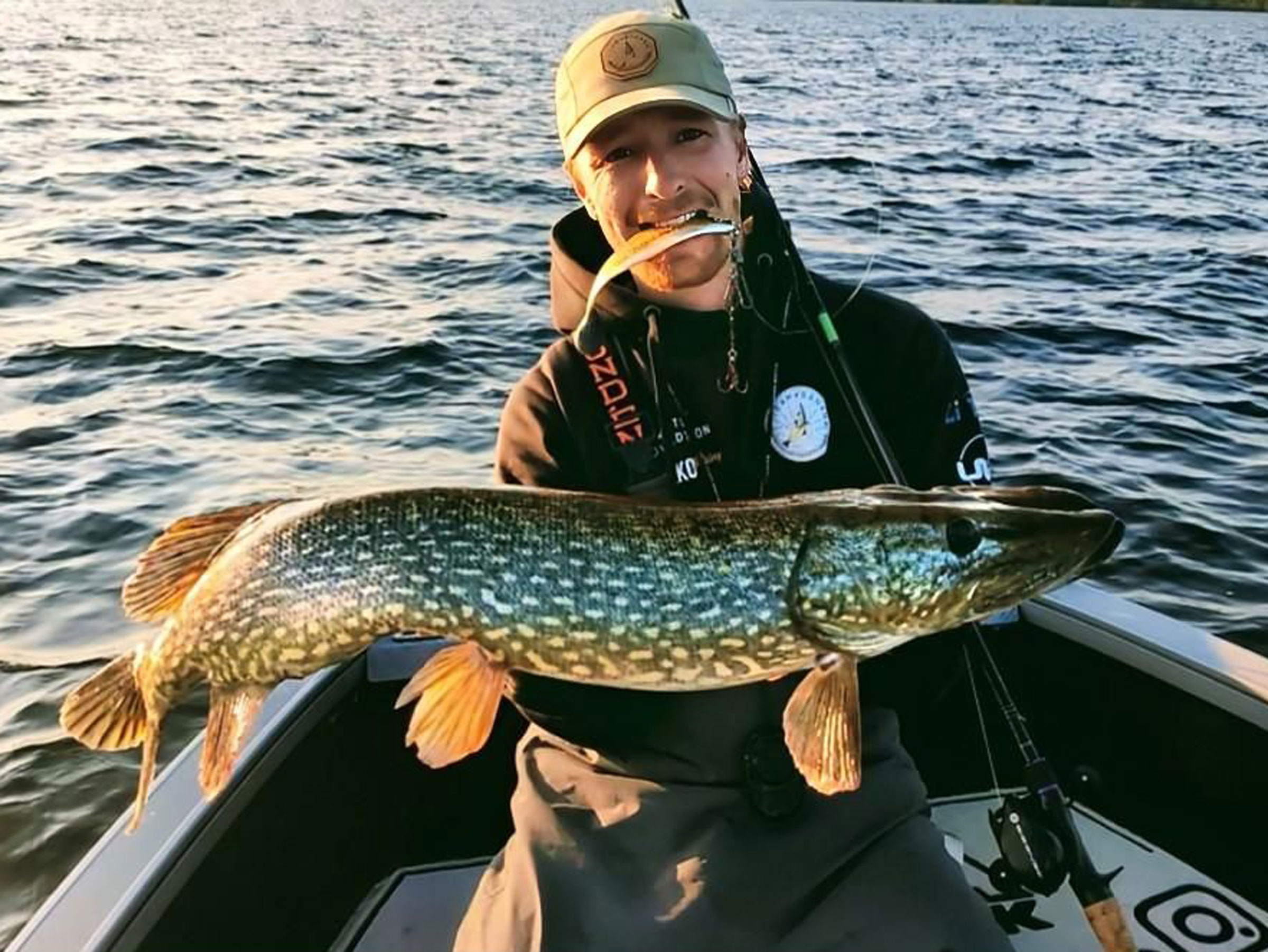 Two anglers fishing from a boat